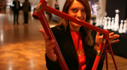booth-at-Many people enjoy Dr. moro demonstrates the lightness of an Iride frame.-bike-show