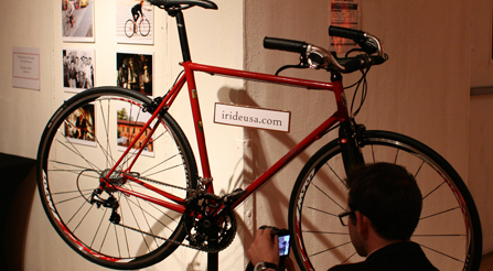 image of A fan making photographs of iride details. Party guests enjoying the glow of high performance Italian bicycles